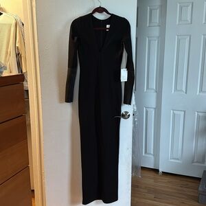 Chic Black V-Neck Long Sleeve Bodycon Dress with leather sleeves.